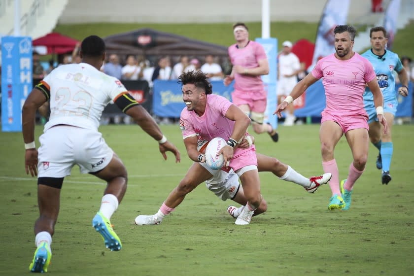 Luke Burton of the LA Giltinis looks to pass against the Austin Gilgronis.