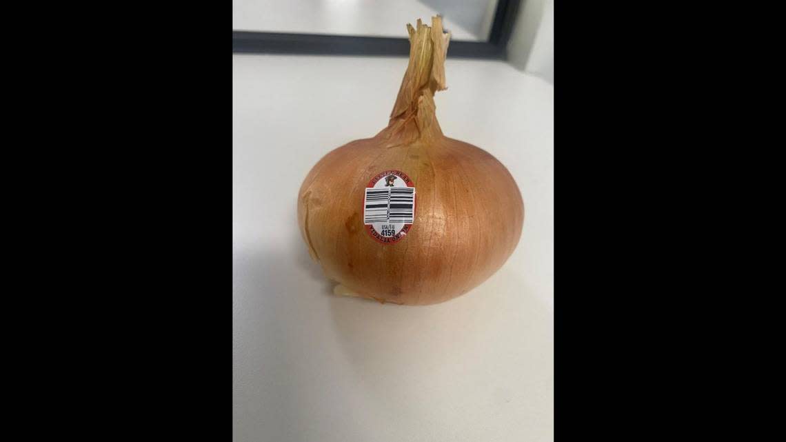 A Vidalia sweet onion with the Little Bear brand tag that’s on onions recalled from Publix and Wegmans.