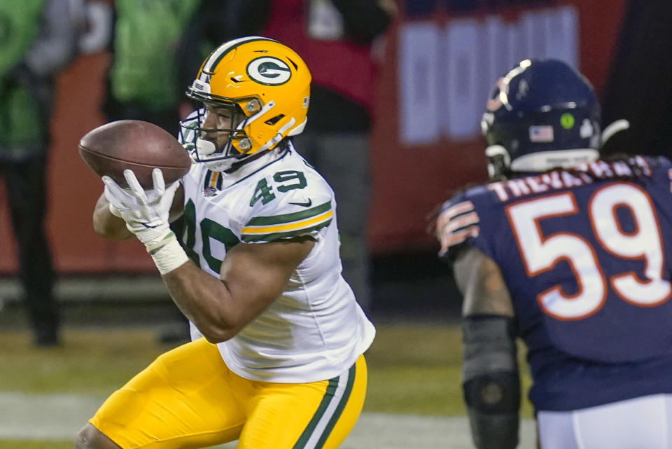 FILE - Green Bay Packers' Dominique Dafney catches a touchdown pass during the first half of an NFL football game against the Chicago Bears in Chicago, in this Sunday, Jan. 3, 2021, file photo. Indiana State hasn’t had anyone drafted in nearly a quarter-century but has two of its former players a game away from the Super Bowl. Both happen to play the same position on the same team. Green Bay Packers tight end Robert Tonyan emerged as one of the league’s breakthrough performers this year. Dominique Dafney went from working at a rooftop patio bar earlier this fall to catching a touchdown pass in the Packers’ regular-season finale.(AP Photo/Charles Rex Arbogast, File)