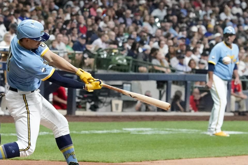 Milwaukee Brewers' Willy Adames hits a three-run home run during the second inning of a baseball game against the New York Yankees Friday, Sept. 16, 2022, in Milwaukee. (AP Photo/Morry Gash)