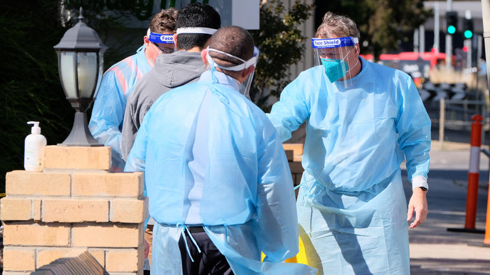 Quarantining hotel guests at the Holiday Inn near Melbourne Airport, pictured here being moved to a new location.