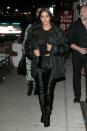 <p>In a sheer black henley, black puffer jacket, leggings, and hip-high Balenciaga boots while out in New York City</p>