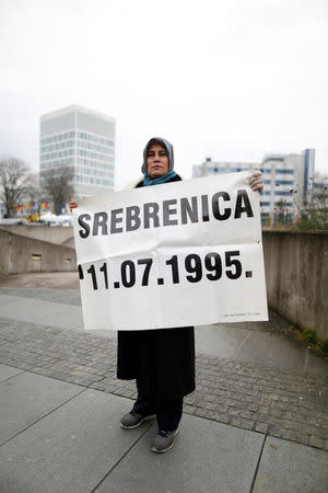 Mothers of victims pose with photos during the trial of former Bosnian Serb military commander Ratko Mladic before a court at the International Criminal Tribunal for the former Yugoslavia (ICTY) in the Hague, Netherlands, November 22, 2017. REUTERS/Cris Toala Olivares