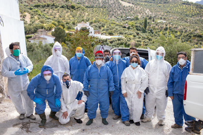 ZAHARA DE LA SIERRA, SPAIN - APRIL 20: The volunteers pose before going to work to disinfect the town during the coronavirus pandemic on April 20, 2020 in Zahara de la Sierra, Spain. Zahara has mostly cut itself off to the outside world since March 14, a decision broadly supported by its residents, many of whom are elderly. Nearly a quarter of Zahara's inhabitants are older than 65, a demographic group at greater risk of COVID-19. (Photo by Juan Carlos Toro/Getty Images)