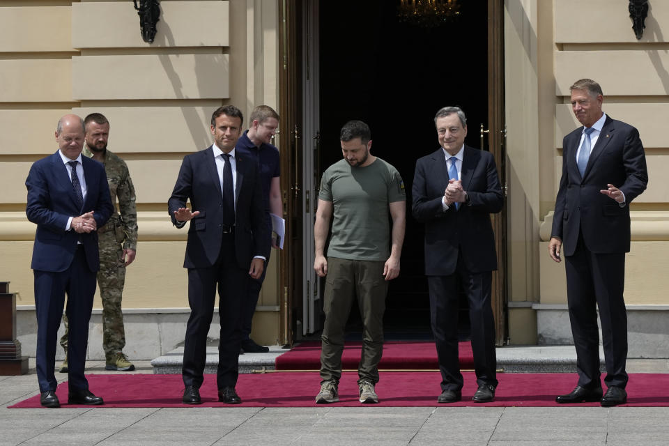 From left, German Chancellor Olaf Scholz, French President Emmanuel Macron, Ukrainian President Volodymyr Zelenskyy, Italian Prime Minister Mario Draghi and Romanian President Klaus Iohannis pose for a picture at the Mariyinsky Palace in Kyiv, Ukraine, Thursday, June 16, 2022. Four European leaders, of France, Italy, Germany and Romania, made a high-profile visit to Ukraine, where they were saw the ruins of a Kyiv suburb on Thursday and denounced the brutality of a Russian invasion that has killed many civilians. (AP Photo/Natacha Pisarenko)