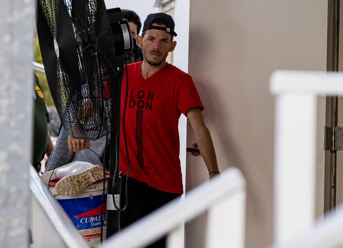 A group of Cuban migrants enter the U.S. Customs and Border Protection office on Sunday, Jan. 8, 2023, in Marathon, Fla.