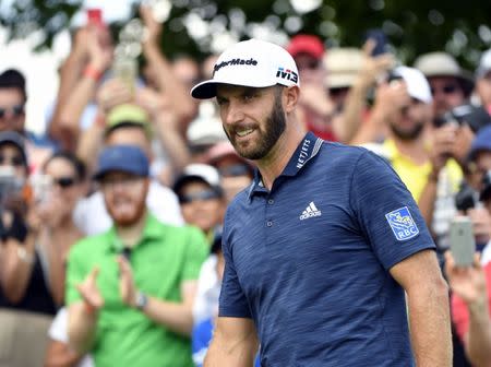 Jul 29, 2018; Oakville, Ontario, CAN; Dustin Johnson arrives on the first hole during the final round of the RBC Canadian Open golf tournament at Glen Abbey Golf Club. Mandatory Credit: Eric Bolte-USA TODAY Sports