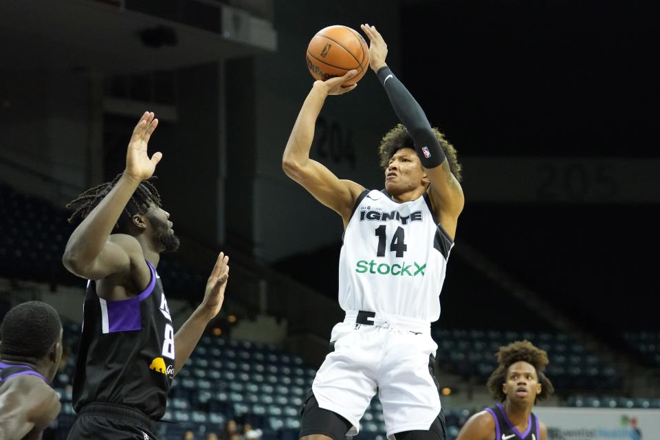 Nov 29, 2021; Stockton, CA, USA; G League Ignite forward MarJon Beauchamp (14) scores over Stockton Kings center Neemias Queta (88) during the first quarter at Stockton Arena. Mandatory Credit: Darren Yamashita-USA TODAY Sports