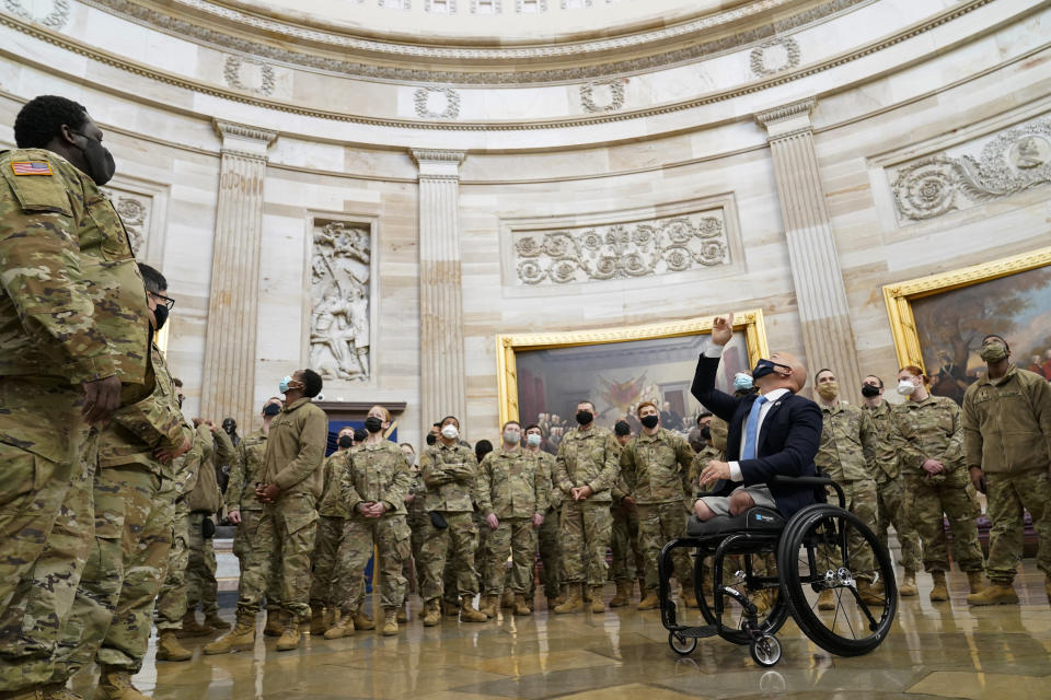 Rep. Brian Mast, R-Fla., gives troops a tour in the Rotunda on Capitol Hill in Washington, Wednesday, Jan. 13, 2021. (AP Photo/Susan Walsh)