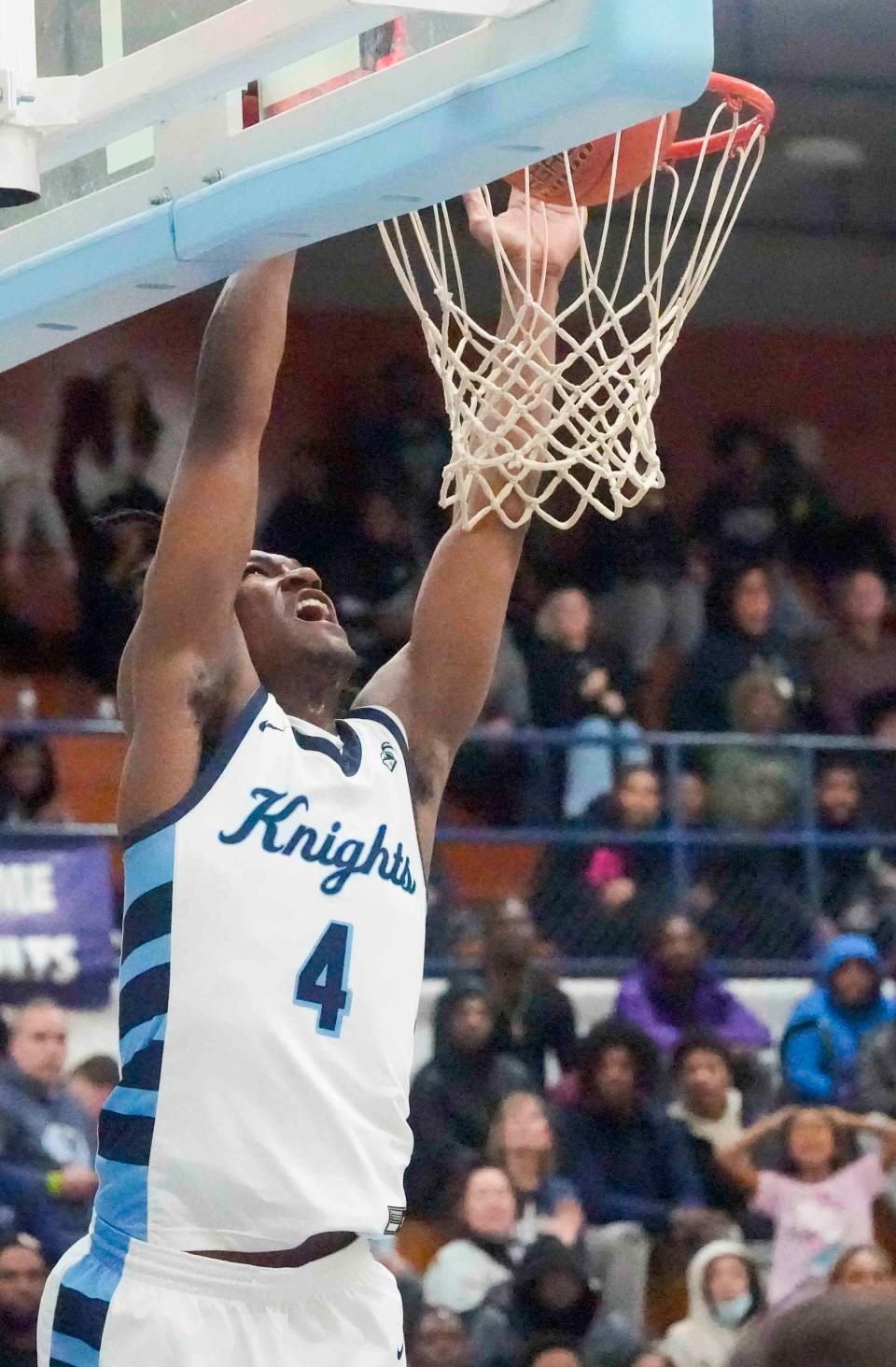 Nicolet senior Nacir Beamon (4) dunks the ball during the first half of their game Tuesday, Dec. 12, 2023, against Grafton at Nicolet High School in Glendale, Wisconsin. Ebony Cox / Milwaukee Journal Sentinel