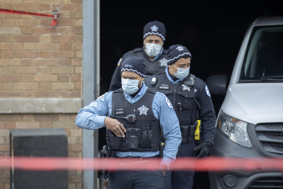 Chicago police officers work the scene of a fatal shooting early Sunday, March 14, 2021, in the Park Manor neighborhood of Chicago. Authorities say gunfire erupted at a party on Chicago’s South Side early Sunday morning. (Erin Hooley/Chicago Tribune via AP)