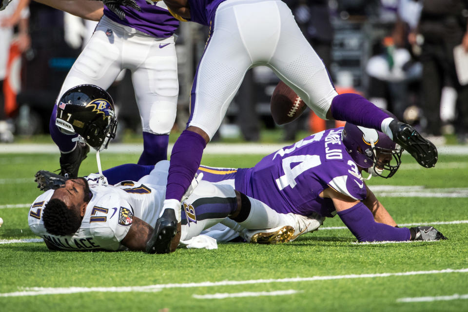 <p>Baltimore Ravens wide receiver Mike Wallace (17) loses his helmet following a hit from Minnesota Vikings safety Andrew Sendejo (34) during the first quarter at U.S. Bank Stadium. Mandatory Credit: Brace Hemmelgarn-USA TODAY Sports </p>