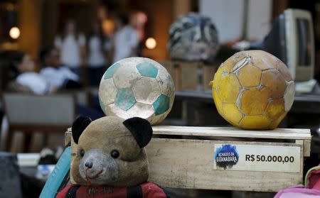Toys collected in the Guanabara Bay is pictured in the exhibition Achados da Guanabara, or Found in Guanabara at the Leblon mall in Rio de Janeiro March 24, 2015. REUTERS/Sergio Moraes
