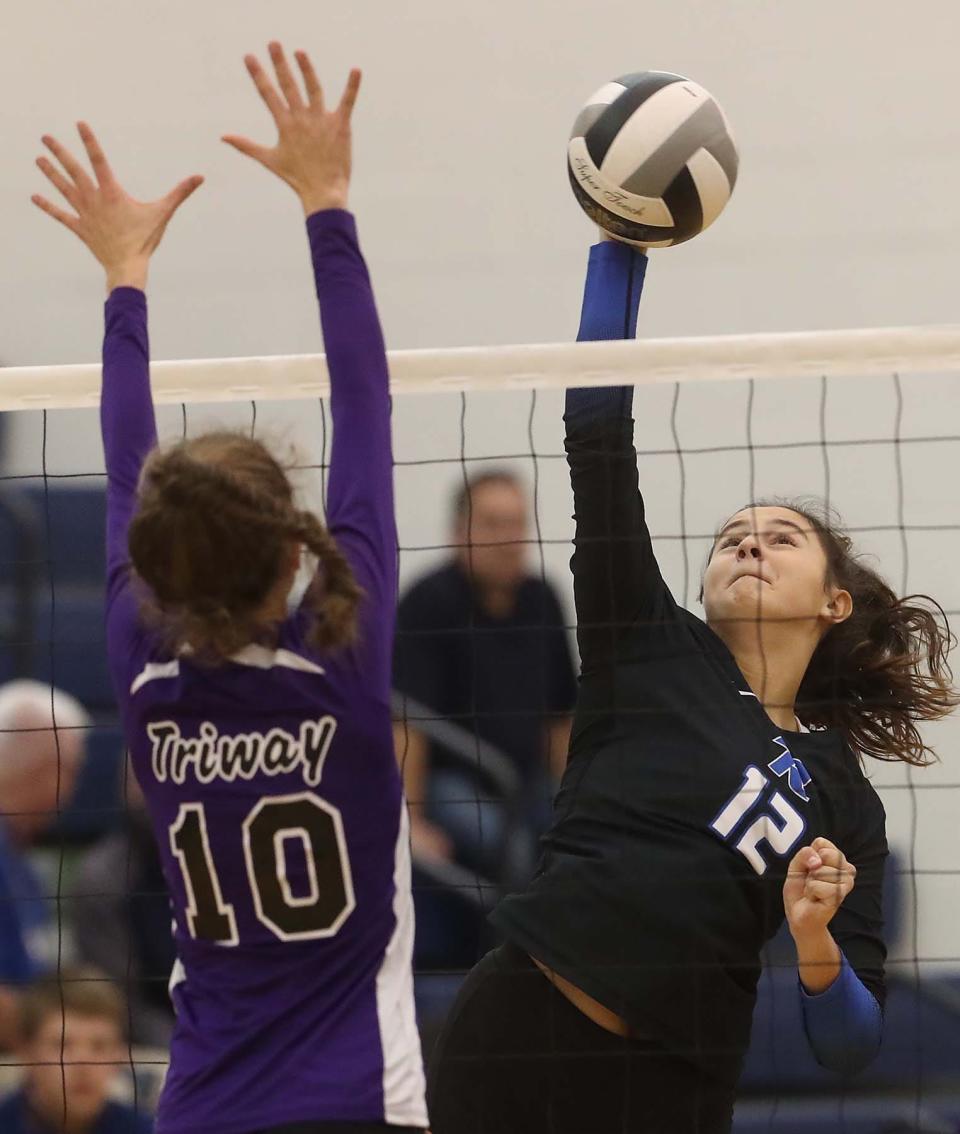 Revere's Jessa Randall spikes the ball in a Division II district semifinal against Triway on Oct. 27, 2021, in Tallmadge.