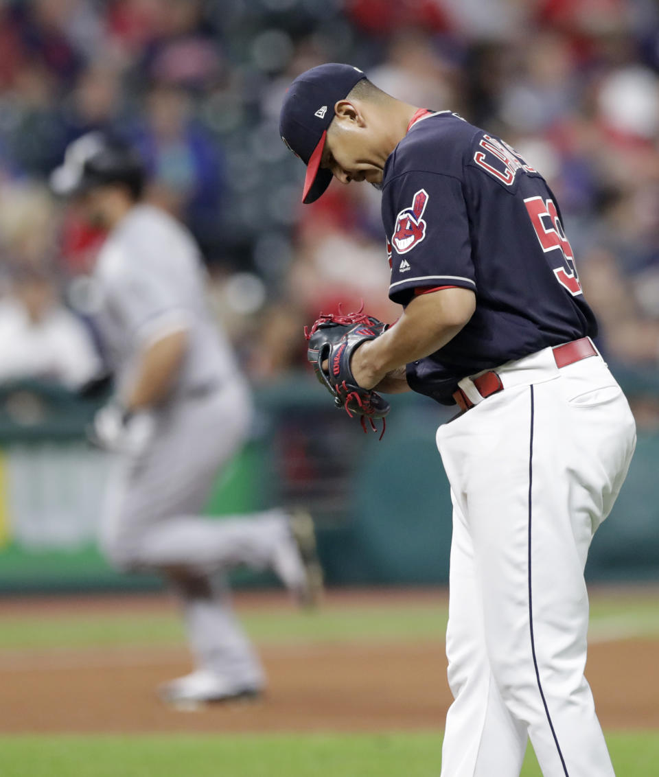 Cleveland Indians starting pitcher Carlos Carrasco waits for Chicago White Sox's Daniel Palka to run the bases after Palka hit a solo home run in the sixth inning of a baseball game, Wednesday, Sept. 19, 2018, in Cleveland. (AP Photo/Tony Dejak)