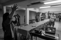 <p>Neighborhood residents attend a free Sunday breakfast and church service at La Requena Belen church in Middletown, Ohio. (Photograph by Mary F. Calvert for Yahoo News) </p>