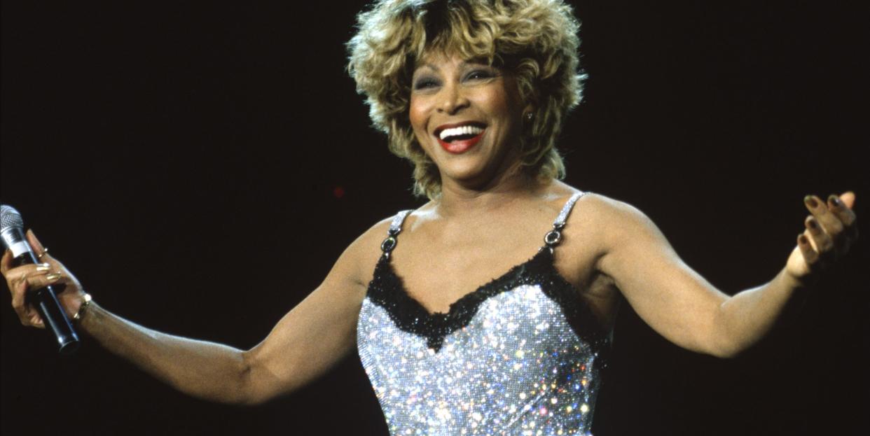 tina turner performs at shoreline amphitheatre in 1997 wearing a sequin silver mini dress