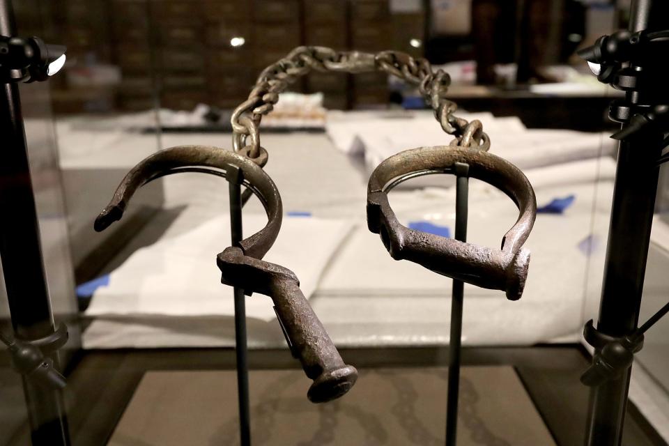 A pair of slave shackles are on display in the Slavery and Freedom Gallery in the Smithsonian's National Museum of African American History and Culture.