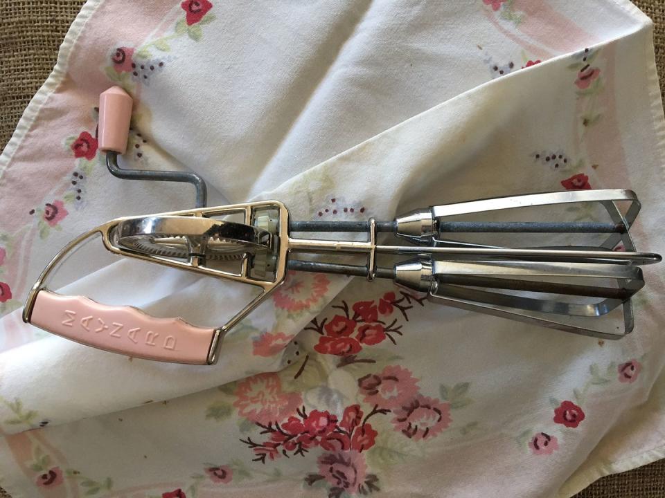 <p>In the days before electric standing mixers, all the blending was done by hand, with little <a href="https://www.etsy.com/listing/494052238/vintage-egg-beater-hand-mixer-pink-hand" rel="nofollow noopener" target="_blank" data-ylk="slk:egg beaters;elm:context_link;itc:0;sec:content-canvas" class="link ">egg beaters</a> like this one.</p>