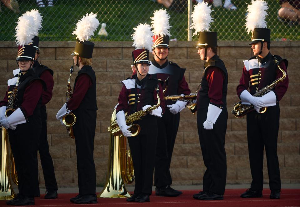 Harrisburg marching band members wait to perform at halftime on Saturday, September 4, 2021 at Harrisburg High School in Sioux Falls.