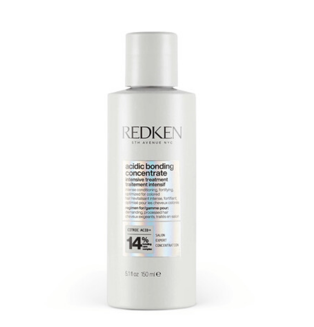 Redken hair treatment bottle labeled "acidic bonding concentrate" for intense repair