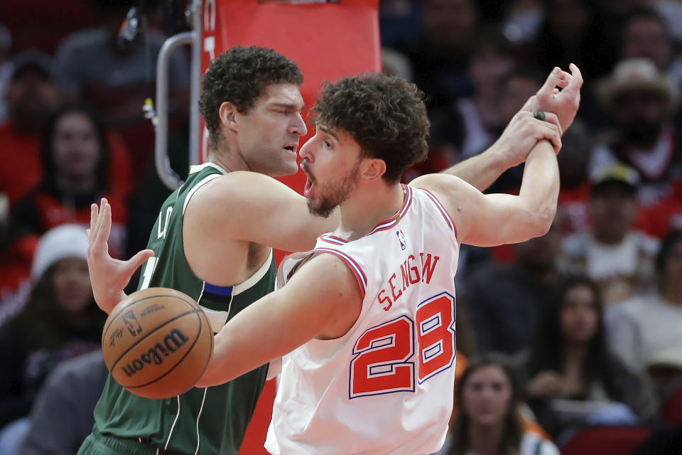 Houston Rockets center Alperen Sengun (28) loses a rebound against Milwaukee Bucks center Brook Lopez, left, during the first half of an NBA basketball game Saturday, Jan. 6, 2024, in Houston. (AP Photo/Michael Wyke)