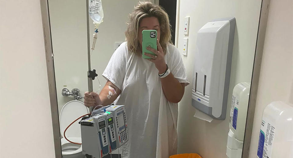 Abbey Smith taking selfie in hospital mirror