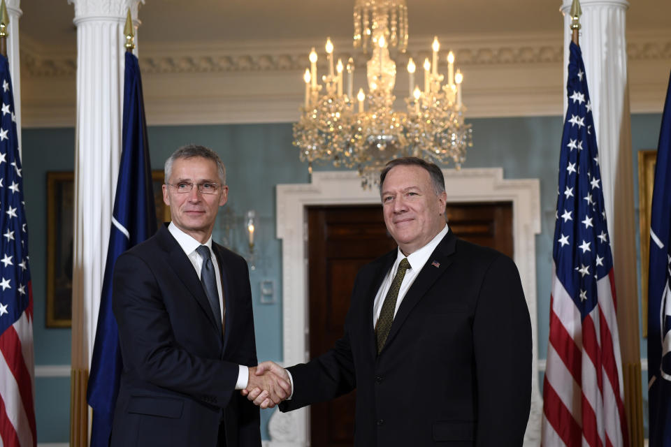 Secretary of State Mike Pompeo, right, shakes hands with NATO Secretary General Jens Stoltenberg, left, as they pose for a photo at the State Department in Washington, Thursday, Nov. 14, 2019. (AP Photo/Susan Walsh)