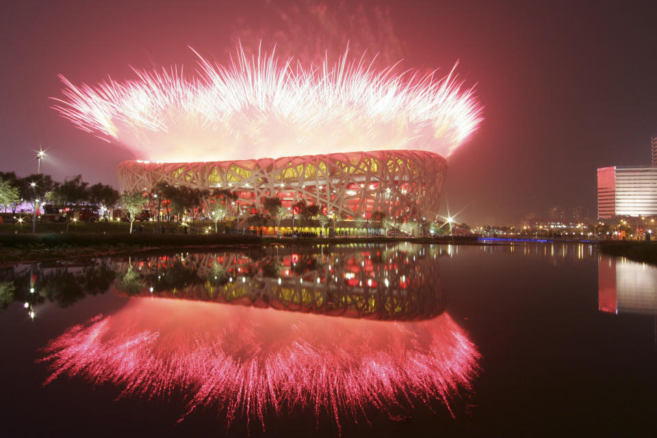 FILE - Fireworks over the National Stadium during opening ceremony fot the 2008 Beijing Olympics in Beijing, Saturday, Aug. 8, 2008. China has undergone history-making change since the last time it was an Olympic host in 2008: It is richer, more heavily armed and openly confrontational. (AP Photo/Bullit Marquez, File)