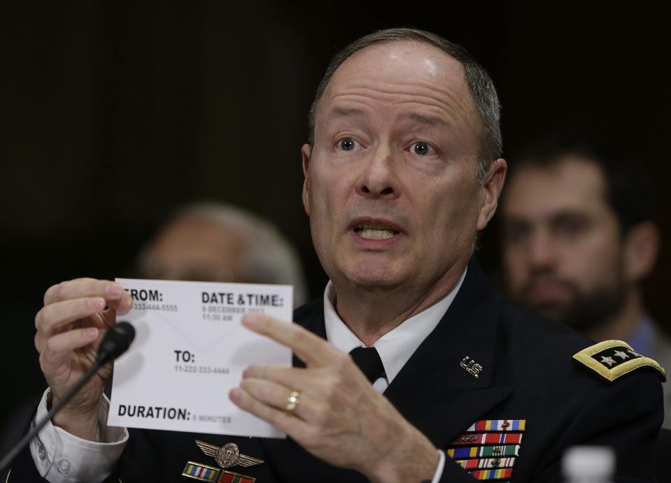 U.S. NSA Director General Alexander uses a library card as an example while testifying before the Senate Judiciary Committee in Washington