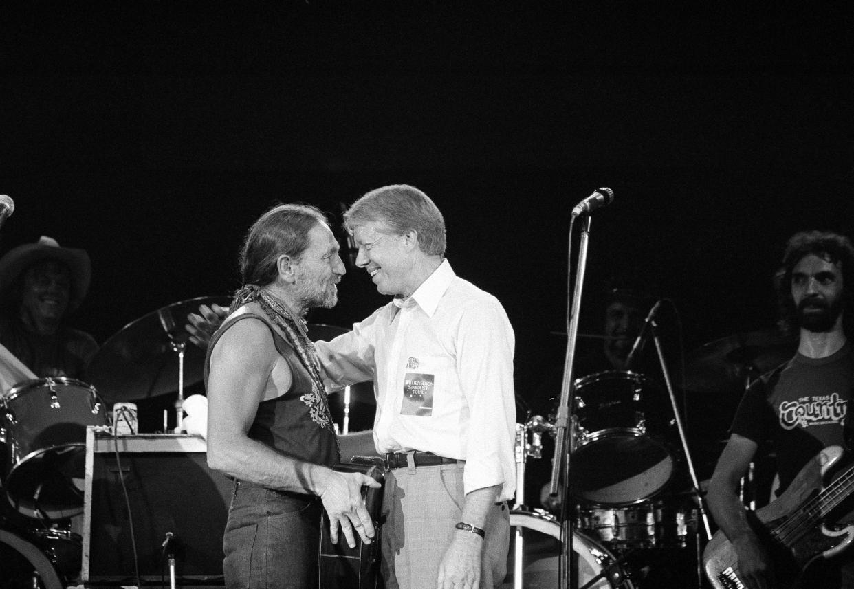 President Jimmy Carter greets Willie Nelson, left, after watching the star country and western music singer perform in a concert at the Merriweather Post Pavillion at Columbia, Md., on July 21, 1978. Nelson performed along with country western singer Many Lou Morris for the President Jimmy Carter and Mrs. Rosalynn Carter who joined thousands of young people for the show. (Photo: AP/Charles Tasnadi)