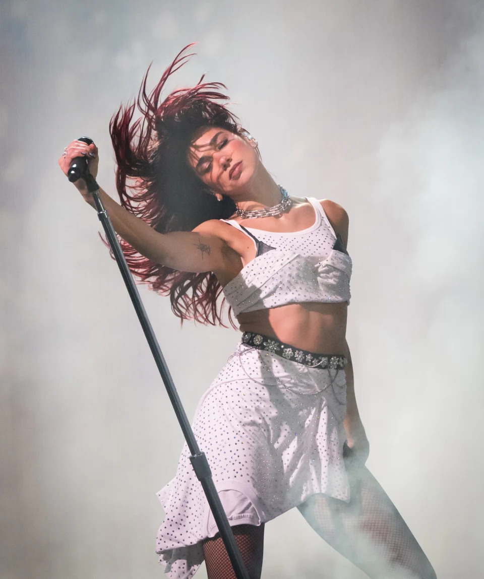  Dua Lipa performs as she headlines the Pyramid stage during day three of Glastonbury Festival 2024 at Worthy Farm, Pilton on June 28, 2024 in Glastonbury, England. Founded by Michael Eavis in 1970, Glastonbury Festival features around 3,000 performances across over 80 stages. Renowned for its vibrant atmosphere and iconic Pyramid Stage, the festival offers a diverse lineup of music and arts, embodying a spirit of community, creativity, and environmental consciousness. (Photo by Samir Hussein/WireImage)
