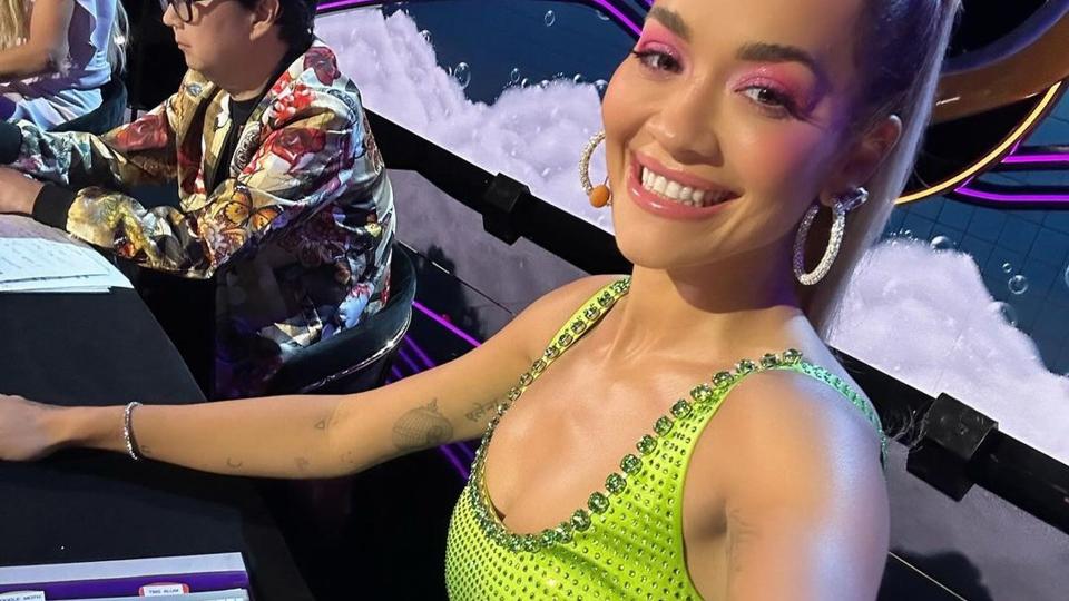 Rita Ora wearing a green dress from Self-Portrait