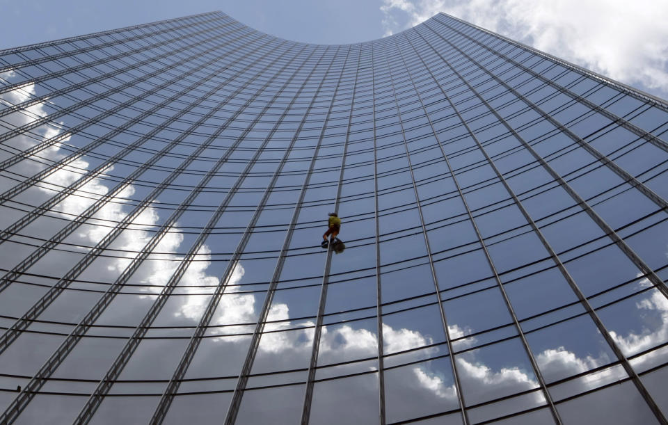 French climber Alain Robert, also known as 'Spiderman', climbs outside the 154 metre (505 feet) high 'Skyper' building in Frankfurt, to raise awareness about global warming, July 7, 2008. REUTERS/Alex Grimm