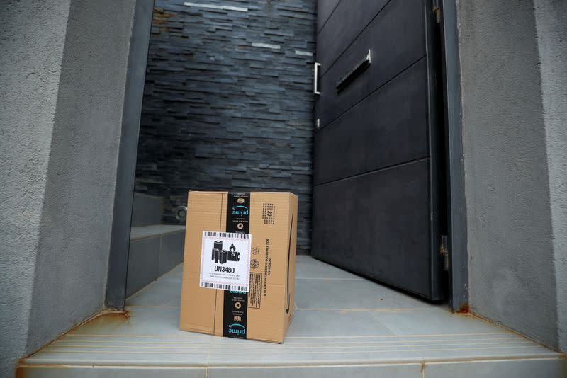 FILE PHOTO: An Amazon package is delivered and left at the door during the coronavirus disease (COVID-19) outbreak in El Masnou