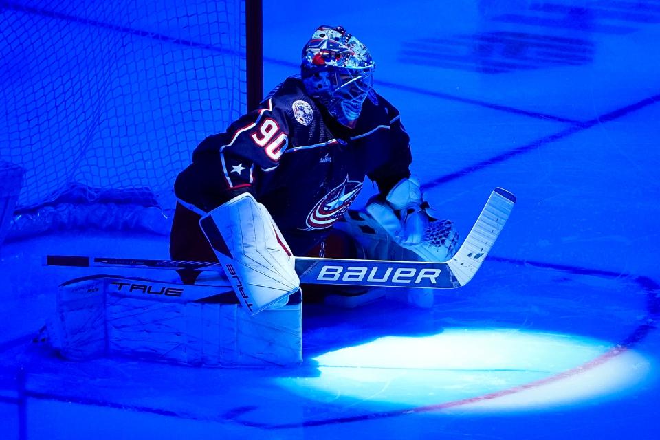 Jan 15, 2024; Columbus, Ohio, USA; Columbus Blue Jackets goaltender Elvis Merzlikins (90) stretches prior to the NHL hockey game against the Vancouver Canucks at Nationwide Arena.