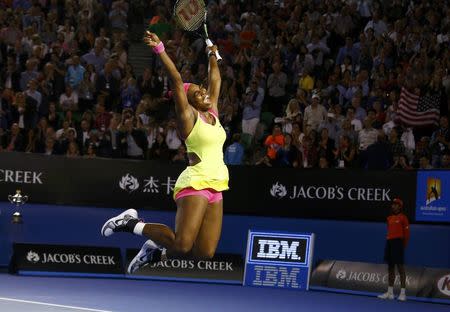 Serena Williams of the U.S. celebrates after defeating Maria Sharapova of Russia in their women's singles final match at the Australian Open 2015 tennis tournament in Melbourne January 31, 2015. REUTERS/David Gray