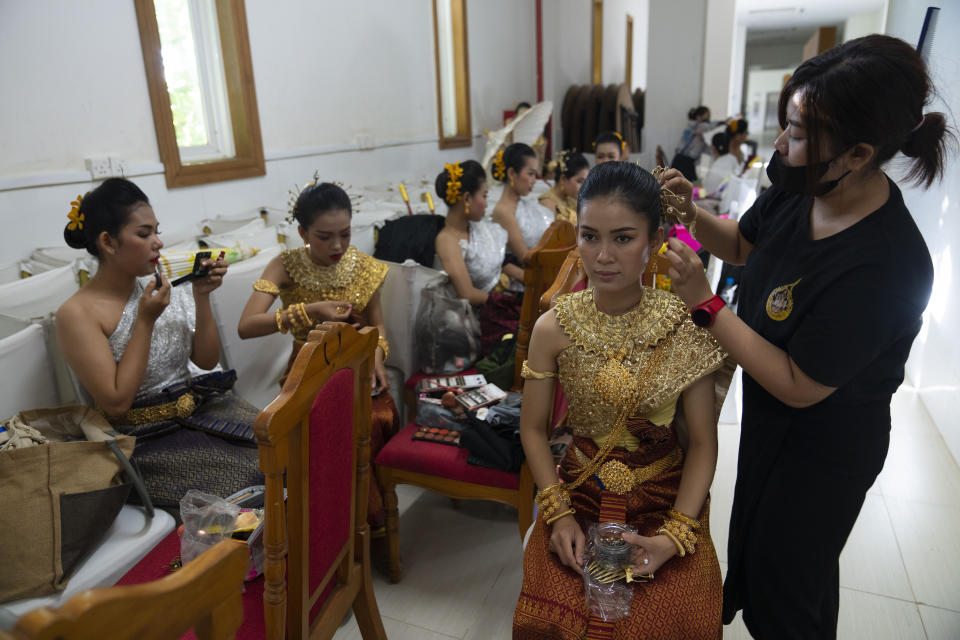 Performers prepare backstage before the opening ceremony of the 55th Association of Southeast Asian Nations (ASEAN) Foreign Ministers Meeting in Phnom Penh, Cambodia on Wednesday, August 3, 2022. (AP Photo/Vincent Thian)
