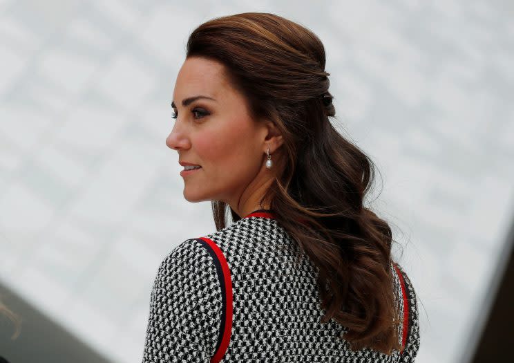 Kate styled her hair in a half up-do, showing off her favorite pearl earrings. (Photo: Reuters)