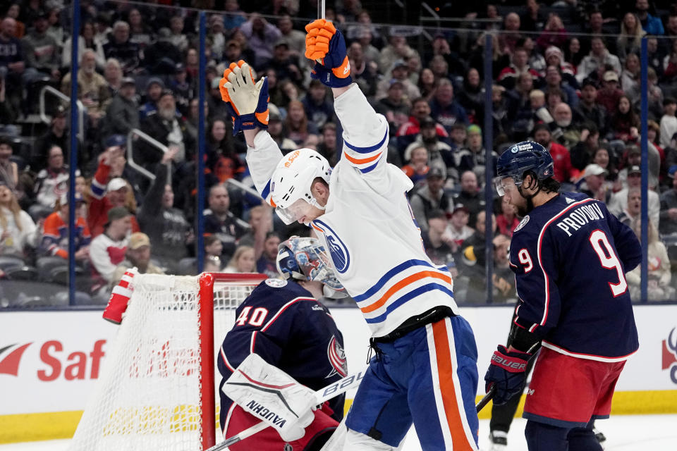 Edmonton Oilers right wing Corey Perry celebrates a goal, next to Columbus Blue Jackets goaltender Daniil Tarasov (40) and defenseman Ivan Provorov (9) during the third period of an NHL hockey game Thursday, March 7, 2024, in Columbus, Ohio. (AP Photo/Sue Ogrocki)