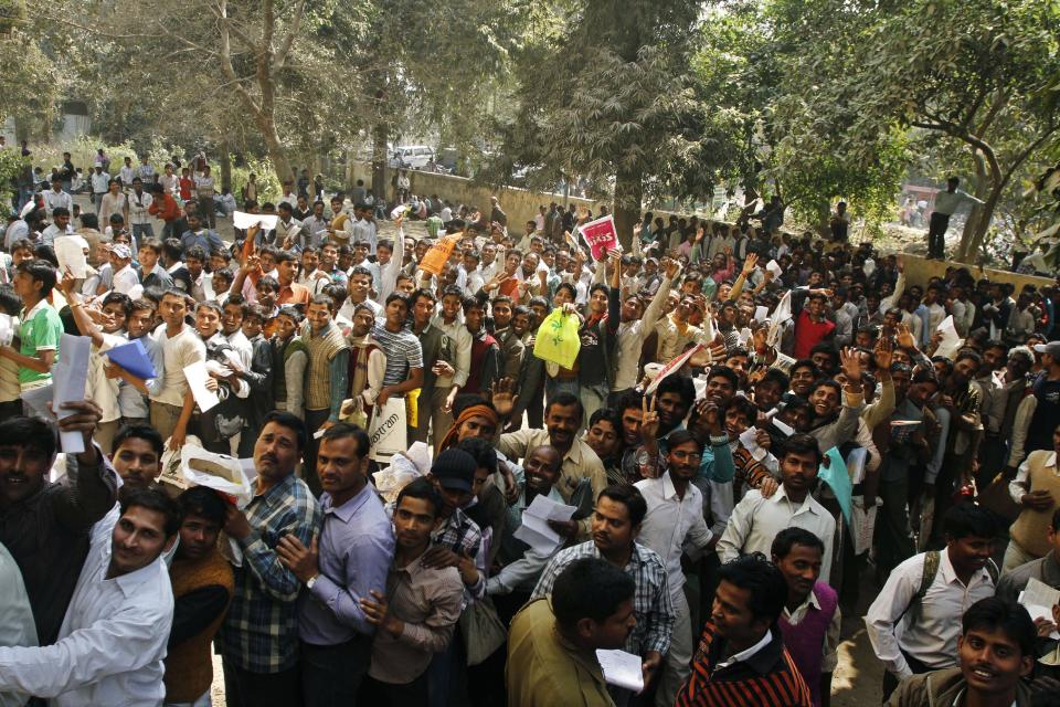 Unemployed Indians line up as they try to register themselves at the Employment Exchange Office (EEO) in Allahabad, India, Wednesday, Feb. 29, 2012. The state government office offers job placement to the registered unemployed applicants when positions become available.(AP Photo/Rajesh Kumar Singh)