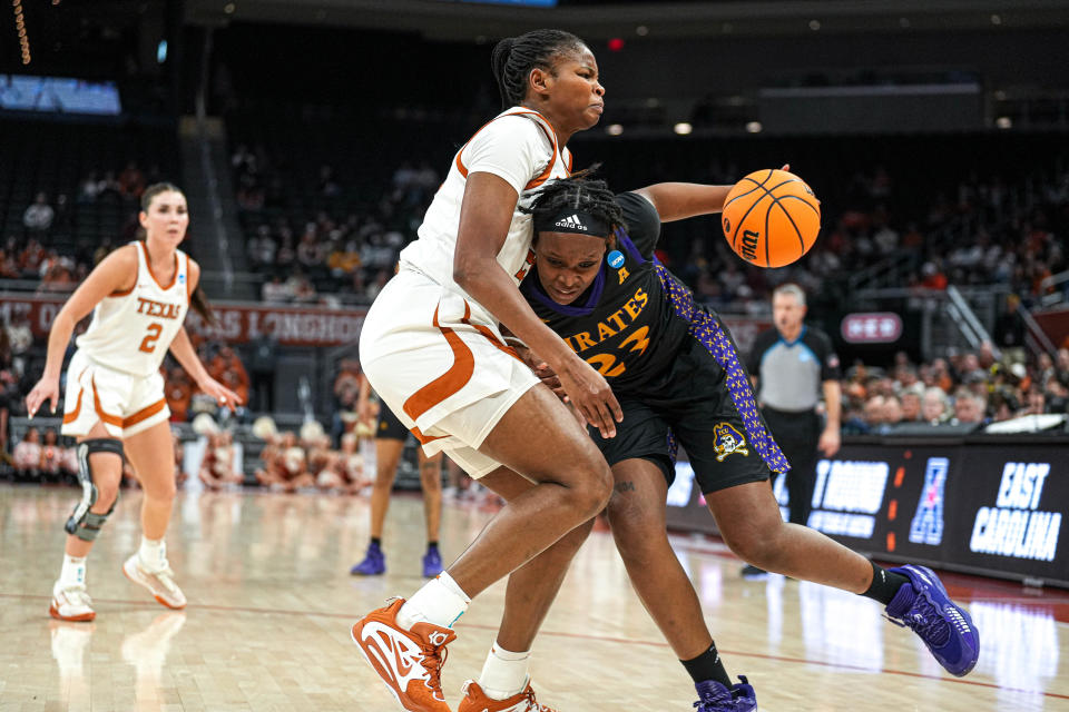East Carolina forward Amiya Joyner collides with Texas forward Khadija Faye during the Longhorns' 70-49 first-round win Saturday night in the NCAA Tournament. Texas used its size advantage down low to dominate the Pirates. Texas' Taylor Jones, DeYona Gaston, Amina Muhammad and Faye combined for 35 points, 21 rebounds and eight of the team’s 12 blocks.