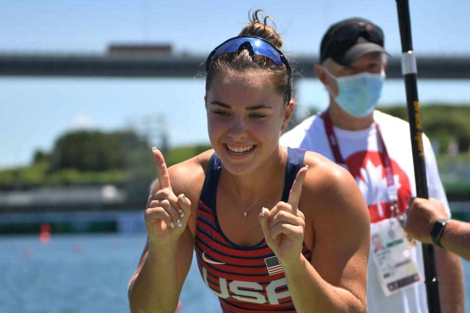 <p>Gold medallist USA's Nevin Harrison celebrates after winning the women's canoe single 200m final during the Tokyo 2020 Olympic Games at Sea Forest Waterway in Tokyo on August 5, 2021. (Photo by Philip FONG / AFP)</p> 