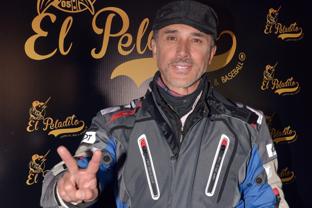 MEXICO CITY, MEXICO - JANUARY 21: Sergio Mayer poses for photo and do peace and love signal during the reopening of the restaurant El Peladito on January 21, 2022 in Mexico City, Mexico. (Photo by Medios y Media/Getty Images)