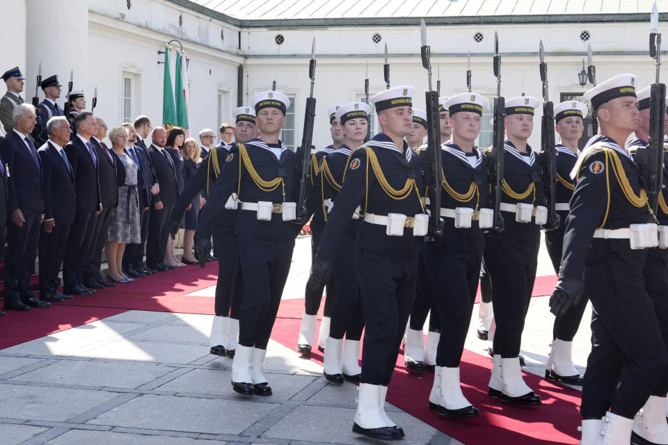 Poland's President Andrzej Duda, third left, and Portuguese President Marcelo Rebelo de Sousa, second left, review honor guards during a state visit at the Belvedere Palace in Warsaw, Poland, Tuesday, Aug. 22, 2023. At a joint news conference de Sousa vowed continuing support for Ukraine's struggle against Russia's invasion, while Duda said Poland is watching Russia's transfer of some nuclear weapons into neighbouring Belarus. (AP Photo/Czarek Sokolowski)