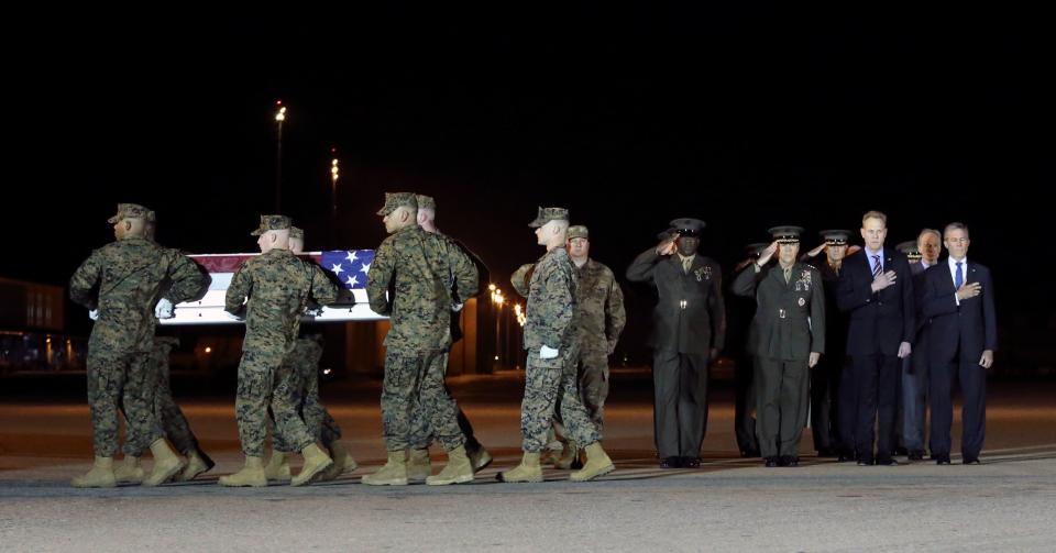 Military officials including (from left) Air Force Col. Matthew Jones, Sgt. Major of the Marine Corps Ronald Green, Marine Corps Commandant General Robert Neller and Acting Secretary of Defense Patrick Shanahan and Gov. John Carney salute during the transfer of remains of Marine Staff Sgt. Christopher A. Slutman at Dover Air Force Base Thursday evening.