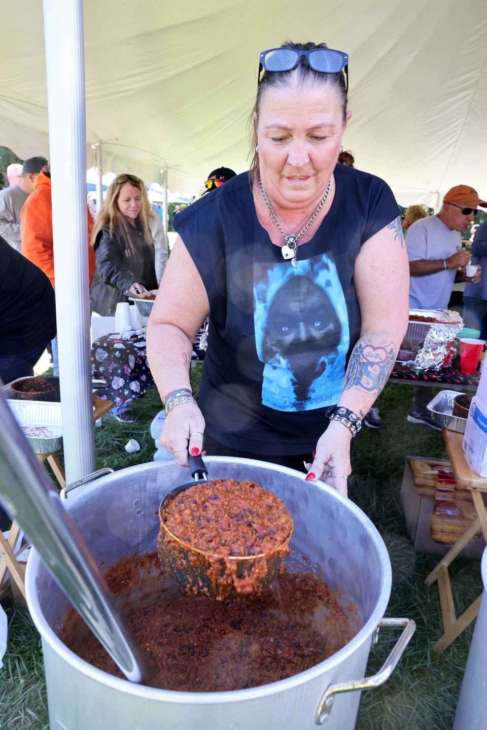 Kim Viau pours a pan of Angry Joe's Chili during the 27th annual ChiliChowda Fest at the East Bridgewater Commercial Club last year.