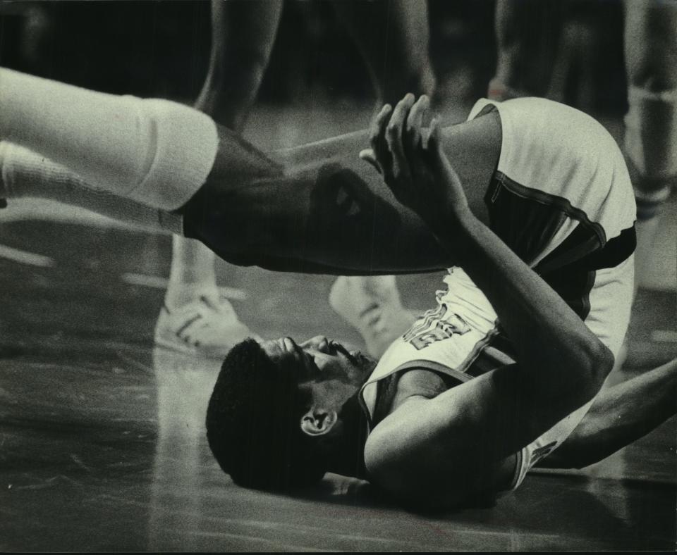 Milwaukee's Marques Johnson was dumped unceremoniously on his back during a playoff game against the Seattle Super-Sonics at the Arena.