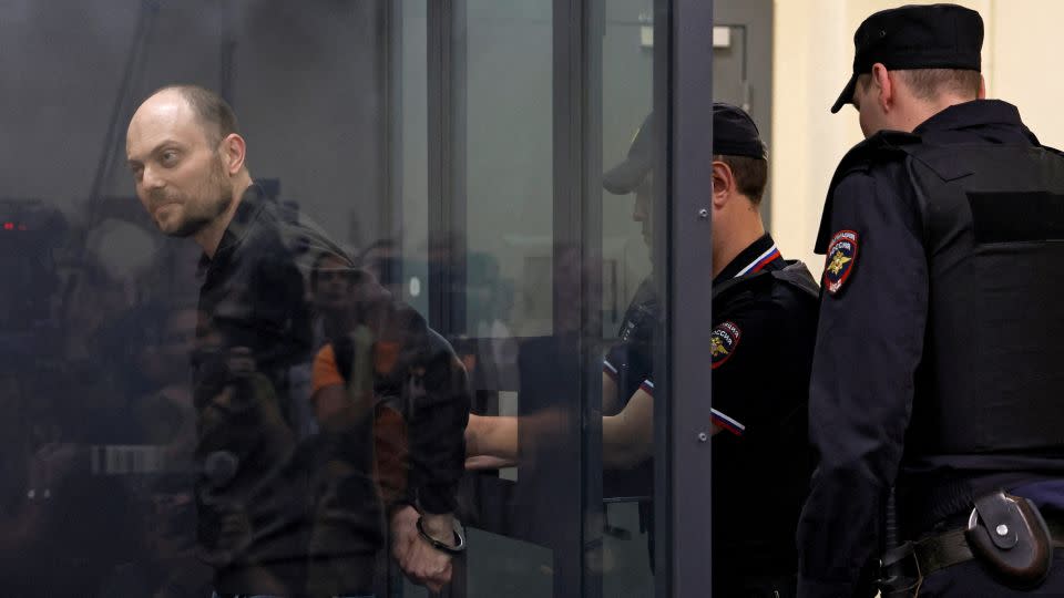 A police officer puts handcuffs on Kara-Murza during a court hearing to consider an appeal against his prison sentence in Moscow on July 31, 2023. - Maxim Shemetov/Reuters