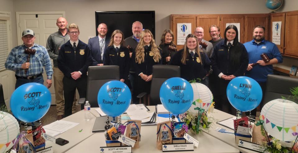 Members of the Gunter FFA Club and members of the school board pose for a photo after the students recognized the board members last week for their efforts toward improving the district.